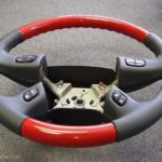 GM 03 steering wheel Victory Red Graphite angle 1