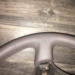 Toyota Land Cruiser Oak Perforated Leather Steering Wheel up close / p1900